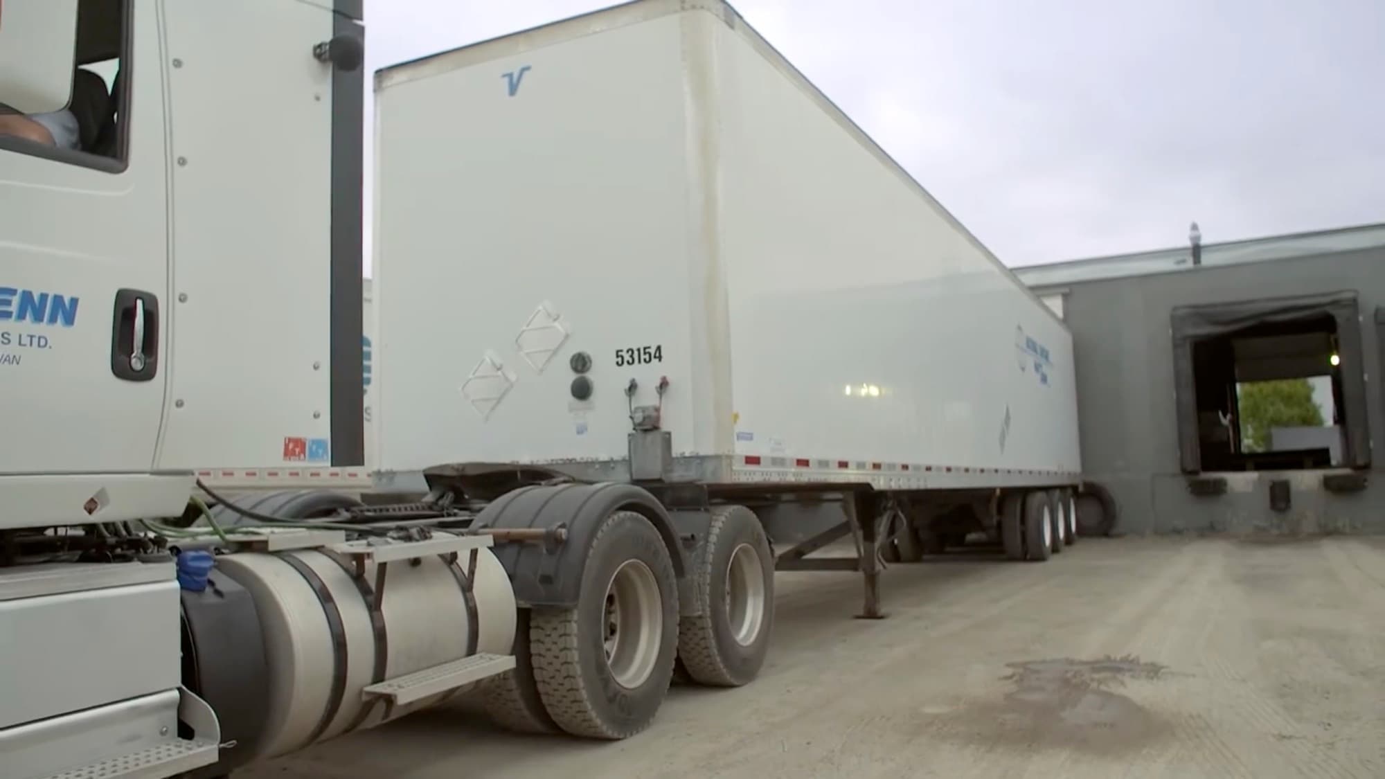 A National Cartage trailer backed into a terminal loading dock